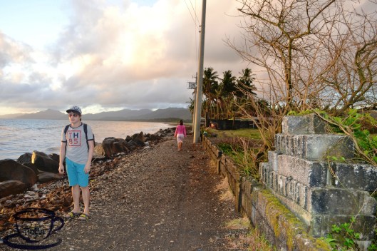 You will pass by this long road going to a port where a boat is waiting to get us on the other side of the island.