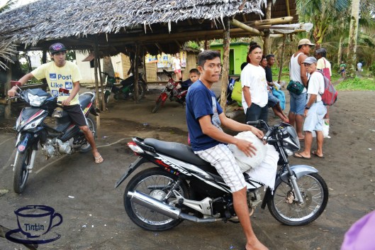 After taking a boat, a group of "habal-habal" drivers are already waiting for a ride.