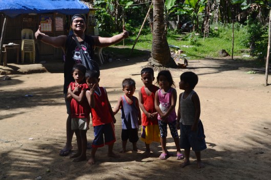 Going back to Mauban town proper, we passed by these kids who asked for a photograph, and my travel boss didn't mind to make one. :)